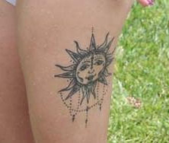 Stylised sun on left leg