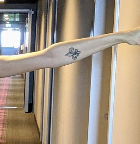 Tattoo on left arm