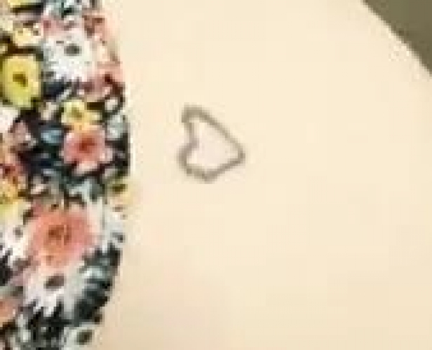 Tattoo heart on left hip