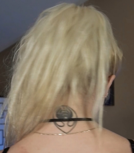 Tattoo in her neck